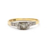 A gold single stone diamond ring,