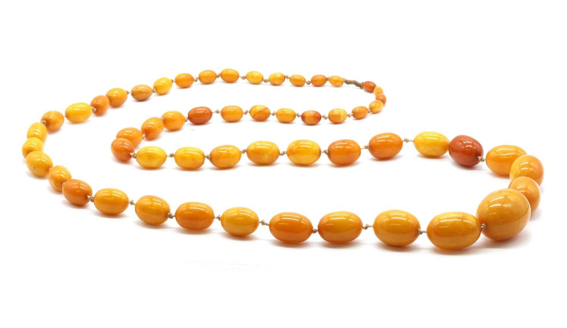 A single row graduated butterscotch amber bead necklace,