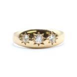 An 18ct gold three stone diamond ring,