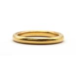 A gold wedding ring,