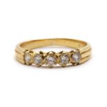 A gold five stone ring,