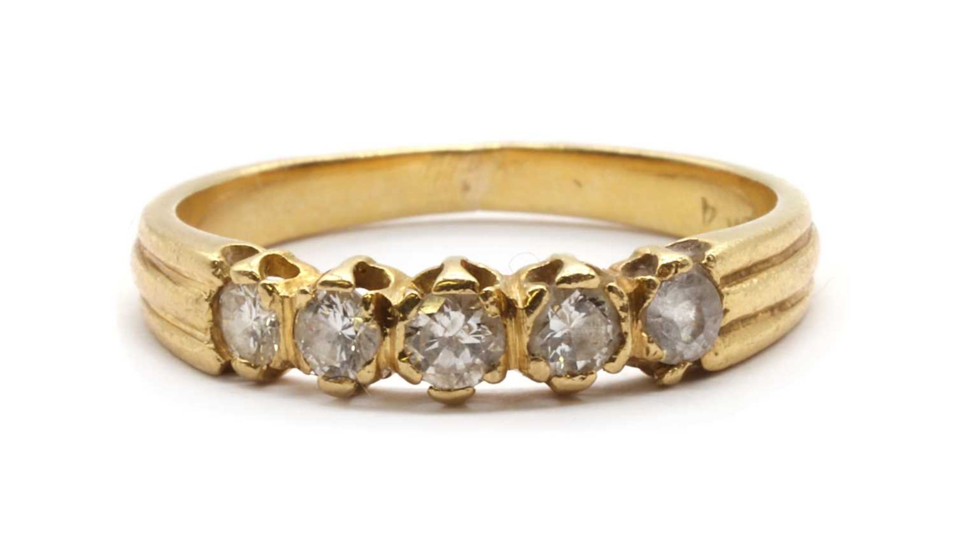 A gold five stone ring,