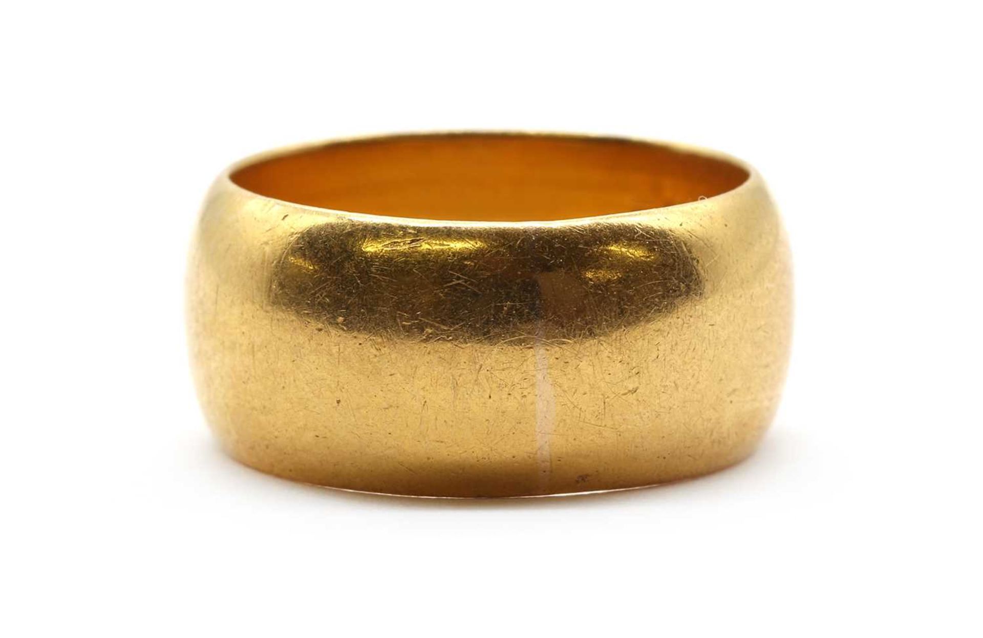 A 22ct gold 'D' section wedding ring,