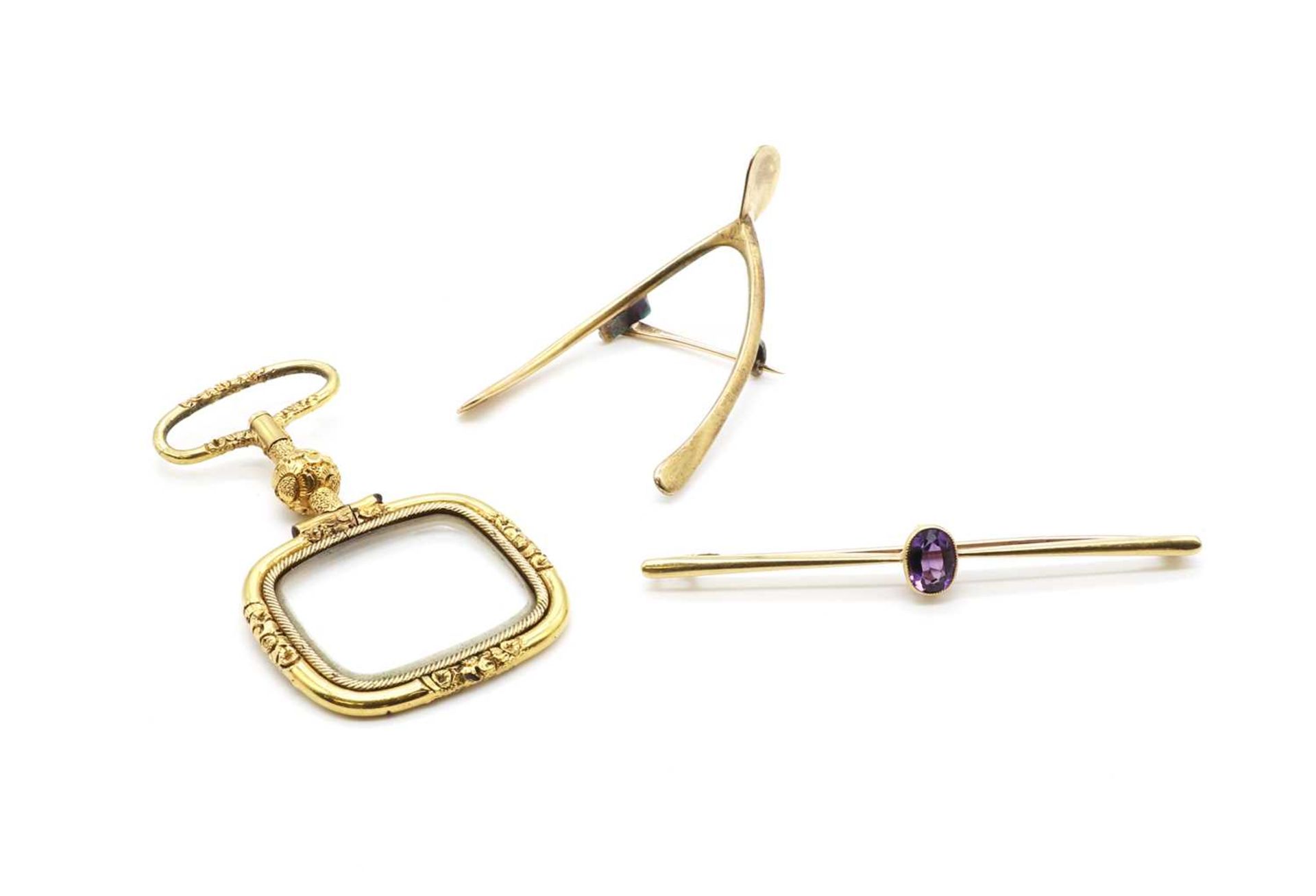 A Victorian 9ct gold wishbone brooch,