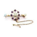 An Edwardian gold opal and amethyst brooch,