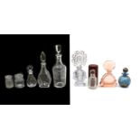 A collection of cut glass perfume bottles and decanters,