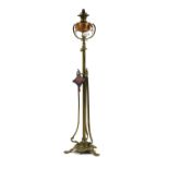 A Victorian floor standing brass and copper oil lamp