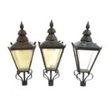 A set of three street lanterns,