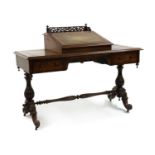 A Victorian rosewood writing table,