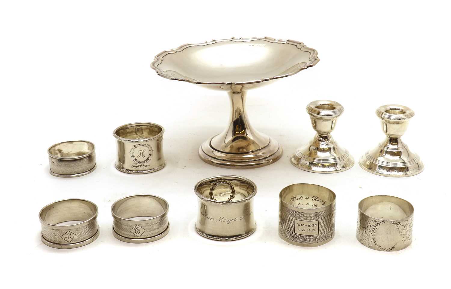 A collection of silver napkin rings,