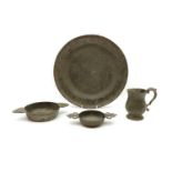 A collection of pewter items