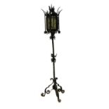 An Arts and Crafts wrought iron standard lamp,