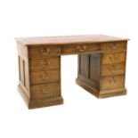 A George III style oak pedestal desk,