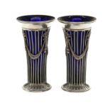 A pair of George V silver vases,