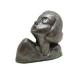 A pewter bust of a girl