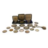 A collection of medals and coins,