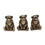 A group of three silver novelty pepperettes,