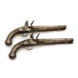 A pair of Turkish 14 bore silver mounted flintlock holster pistols,