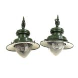 A pair of green painted industrial pendant lights,