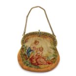 A gilt metal mounted needlework lady’s evening bag