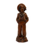 A limewood carving of a sailor,