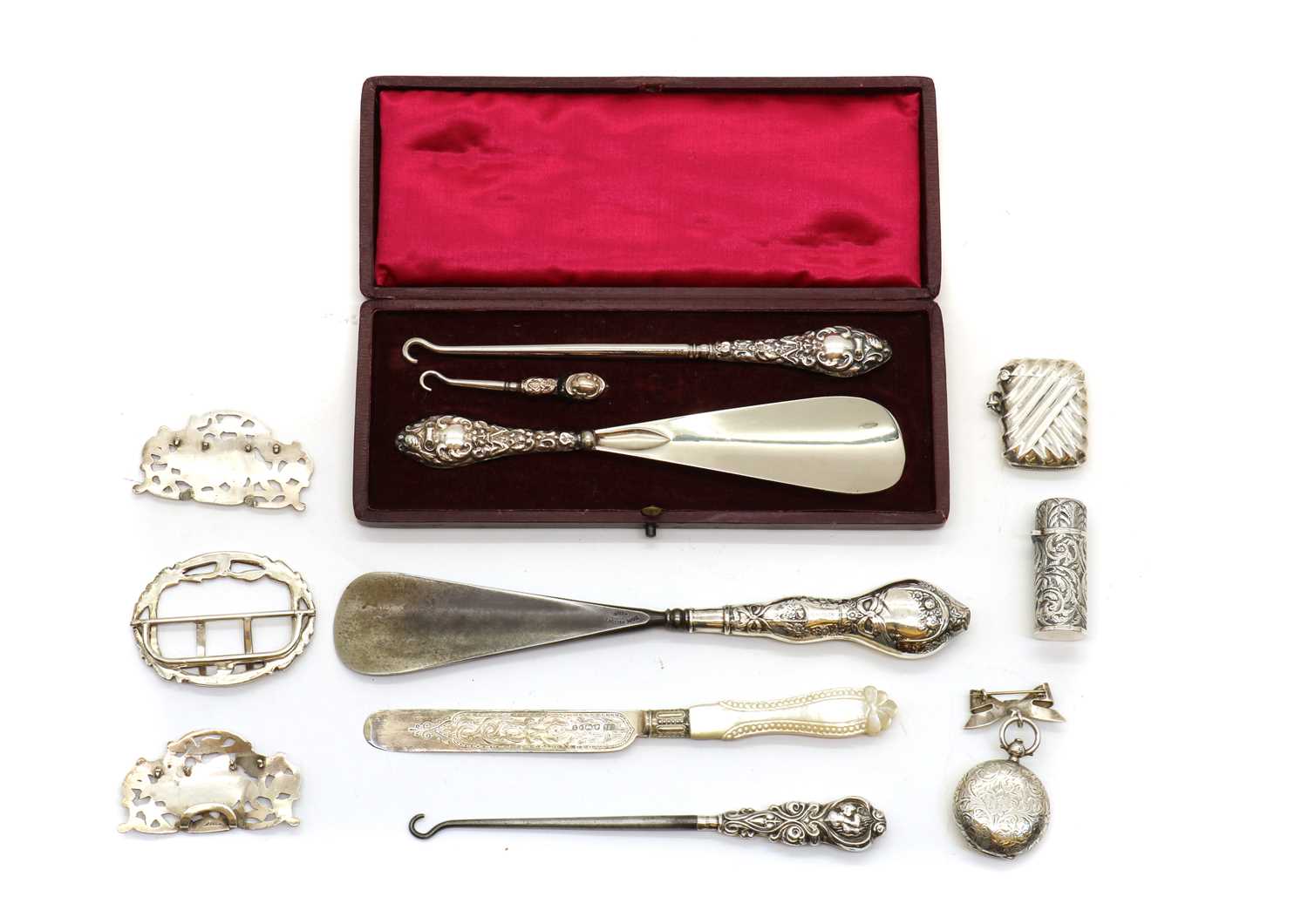 A collection of silver novelty items