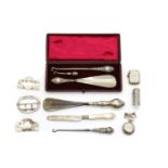 A collection of silver novelty items