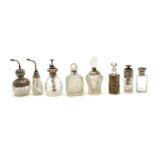A collection of silver mounted cut glass atomisers,