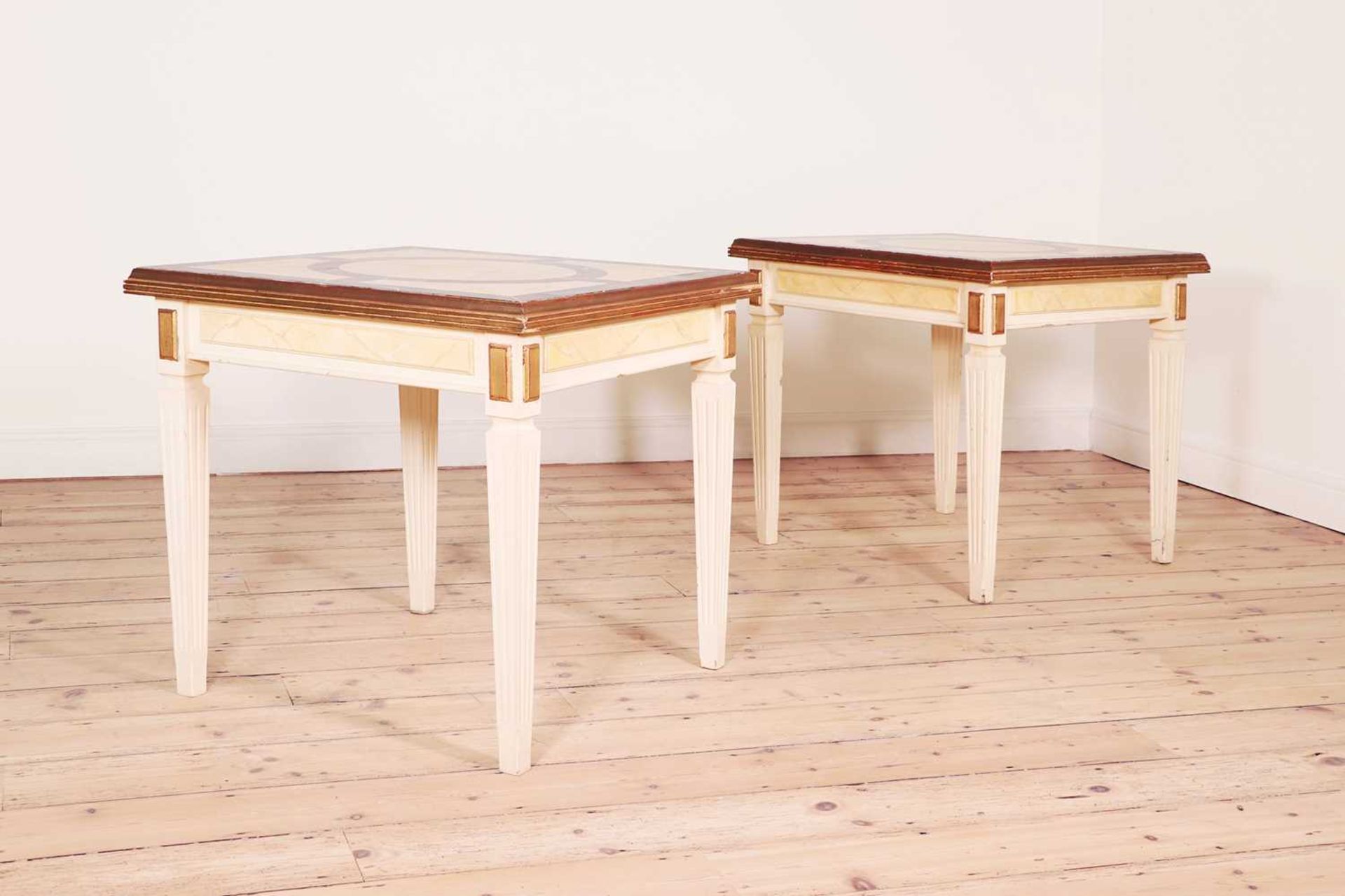 A pair of painted wooden side tables,