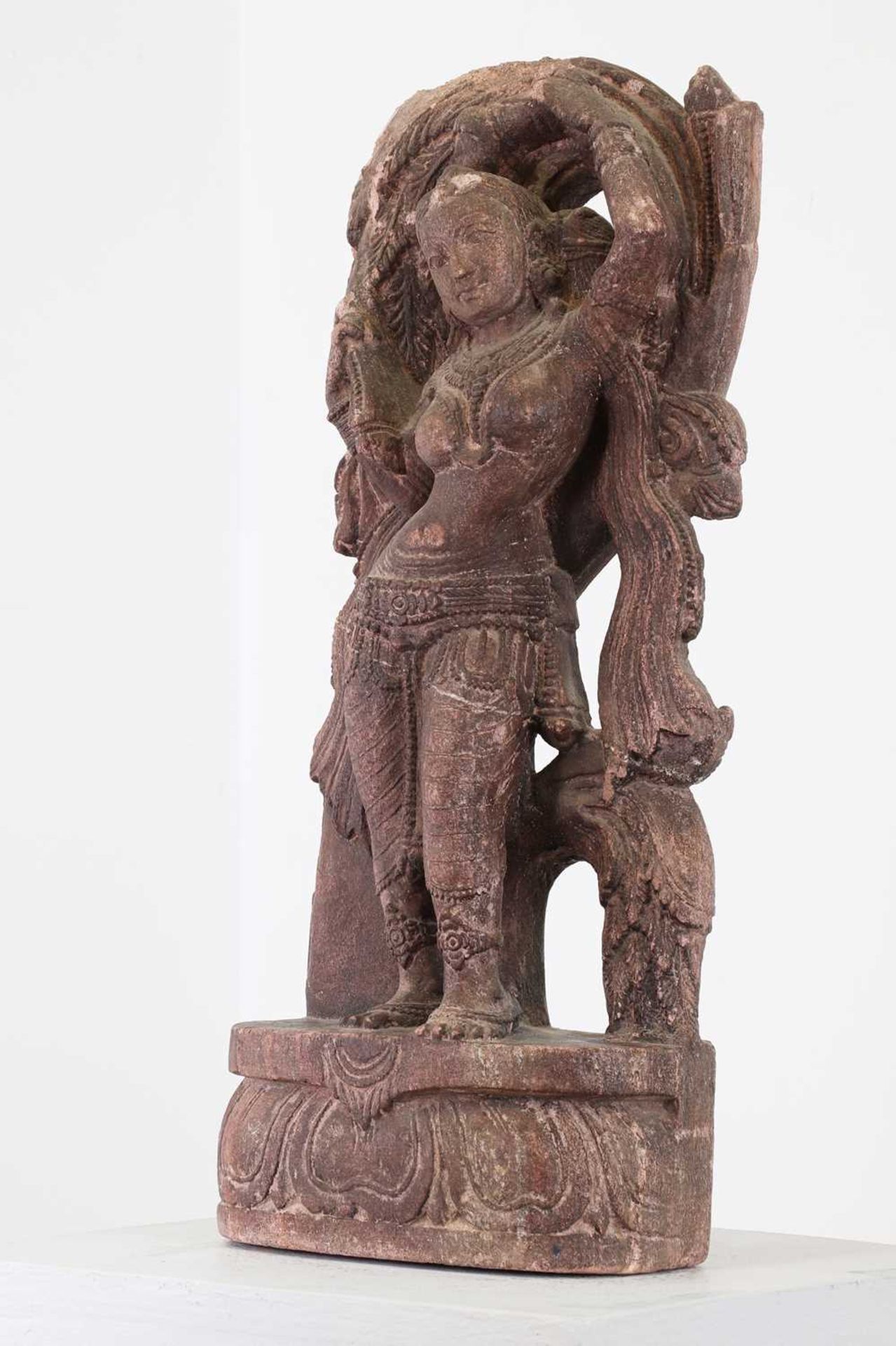 A carved sandstone or possibly composite figure of a dancing apsaras, - Image 4 of 4