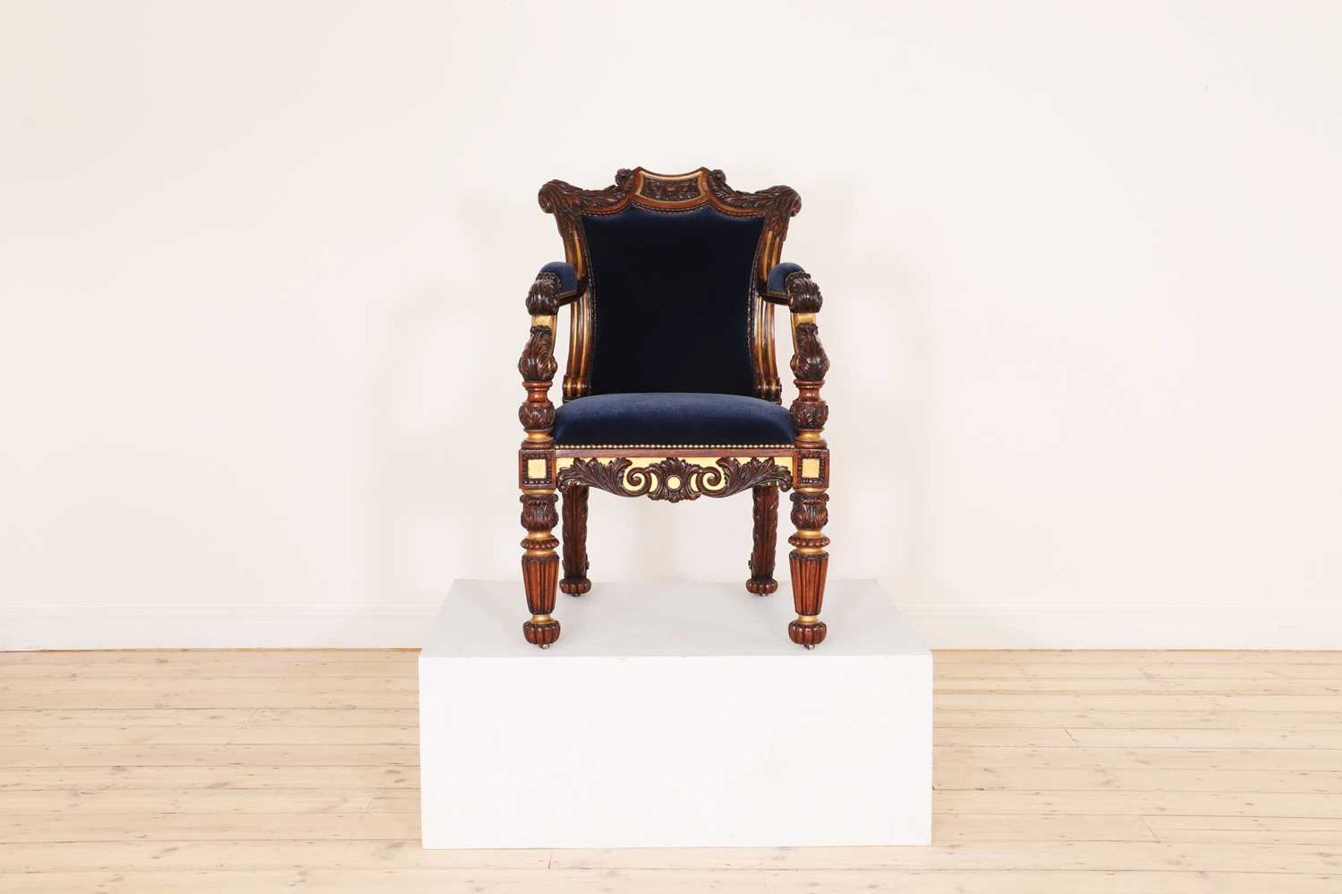 A Regency rosewood and parcel-gilt armchair,