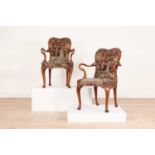 A pair of Queen Anne-style walnut armchairs,