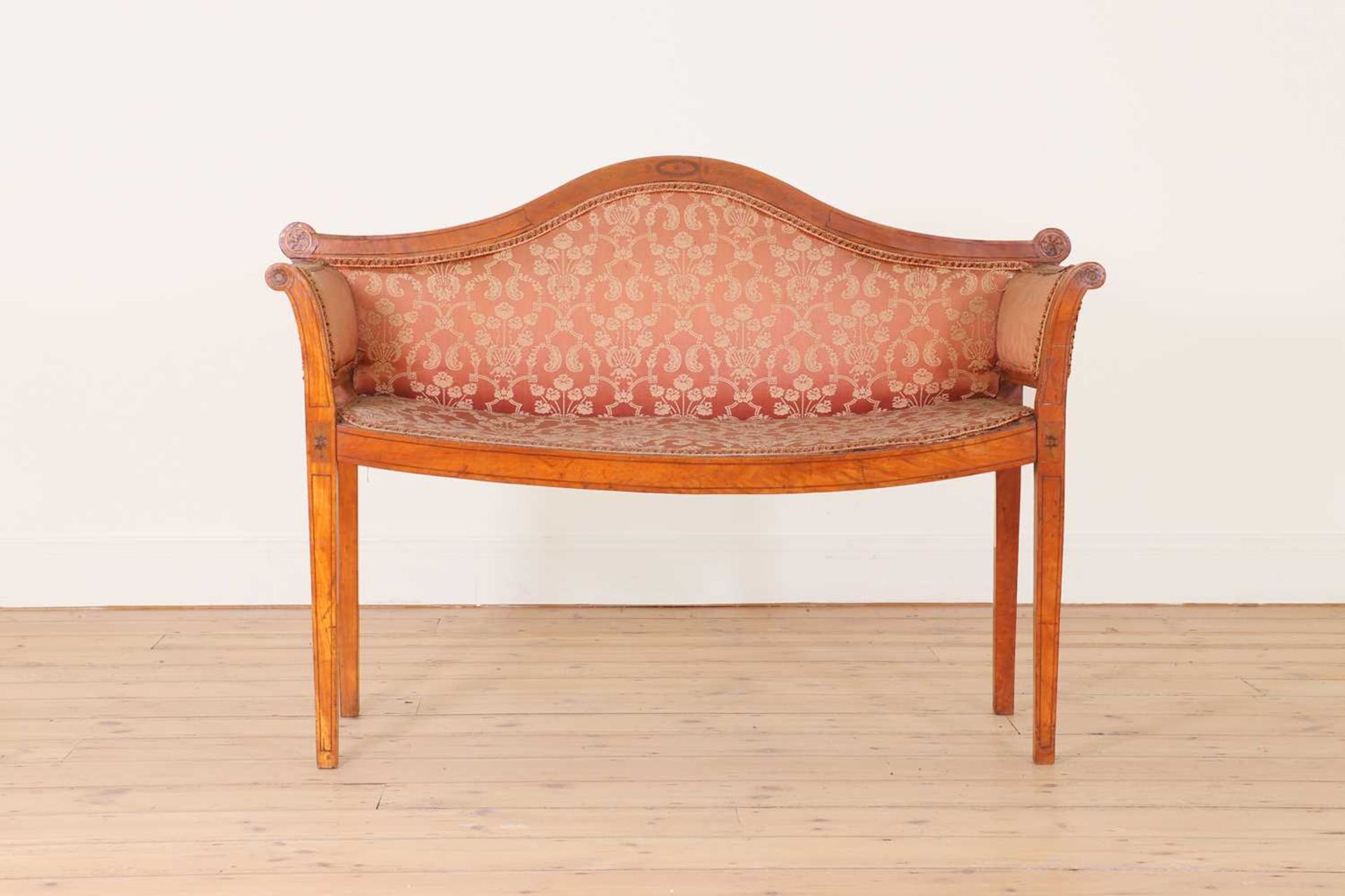 An Edwardian strung and inlaid satinwood window seat,