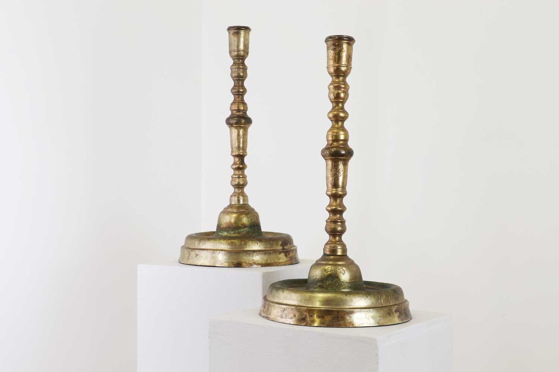 Two gilt-brass candlesticks,