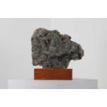 A grey schist carving fragment,