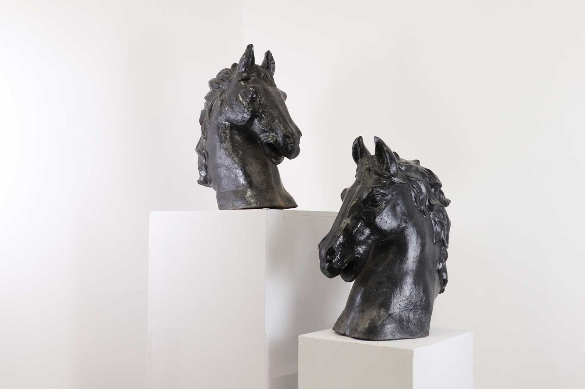 A pair of cast iron horses' heads,