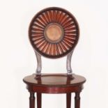 A George III mahogany hall chair by Thomas Chippendale,