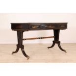 A Regency-style ebonised writing table,