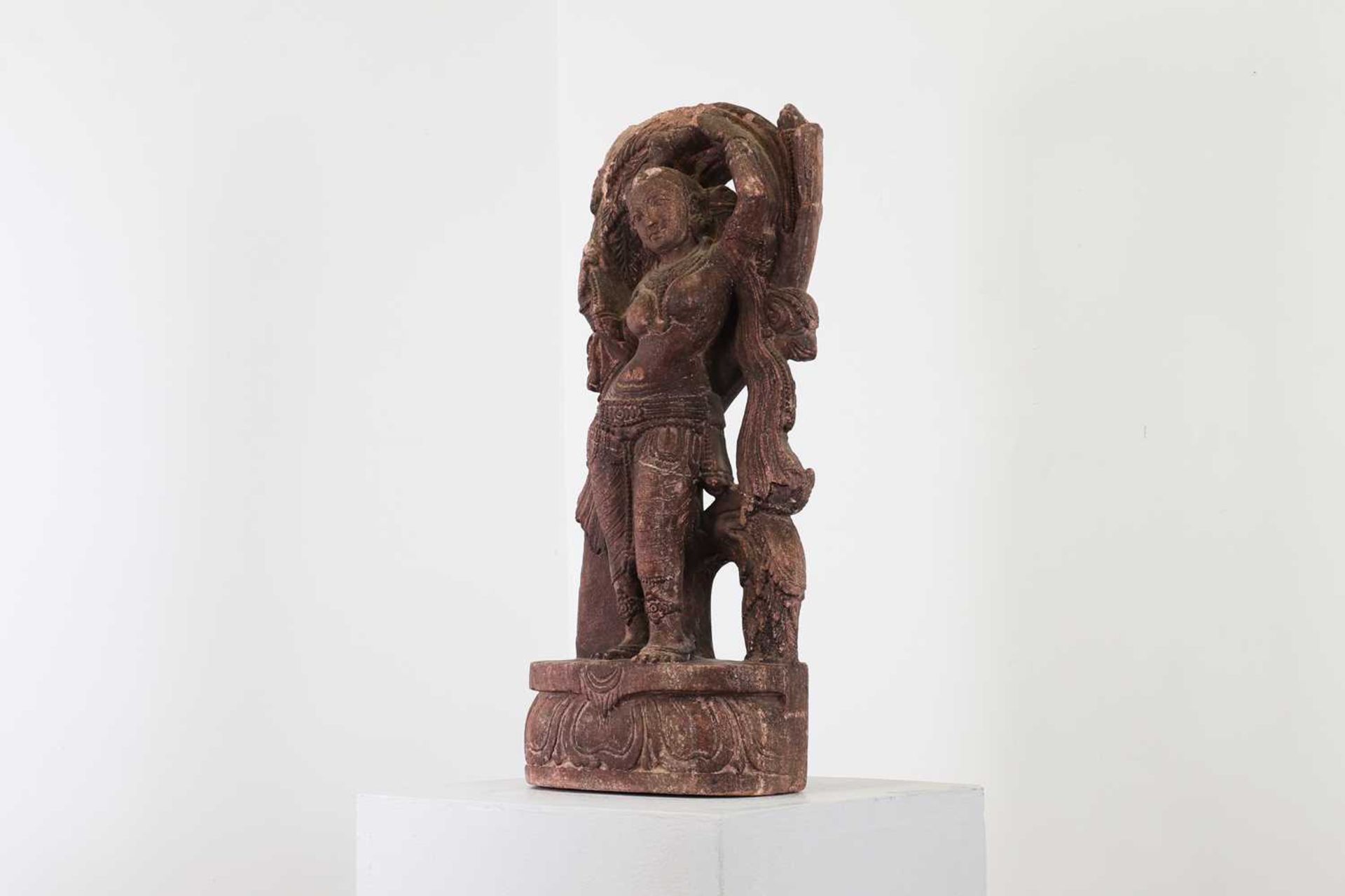 A carved sandstone or possibly composite figure of a dancing apsaras, - Image 2 of 4