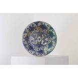 A Persian blue and white pottery bowl,