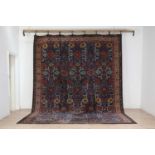 A wool carpet of Persian design,