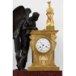 A large Empire ormolu, bronze and marble mantel clock,