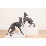 A pair of large bronze figures of whippets,