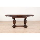 An oak and walnut draw-leaf table,