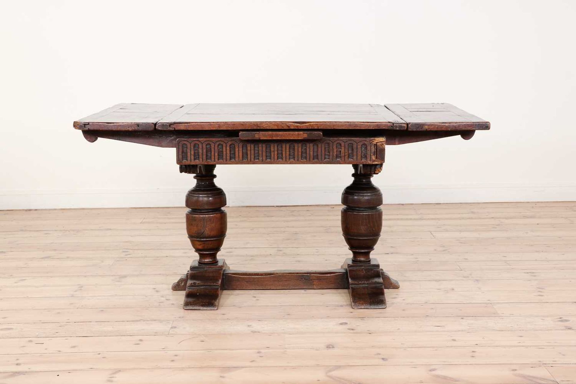 An oak and walnut draw-leaf table,