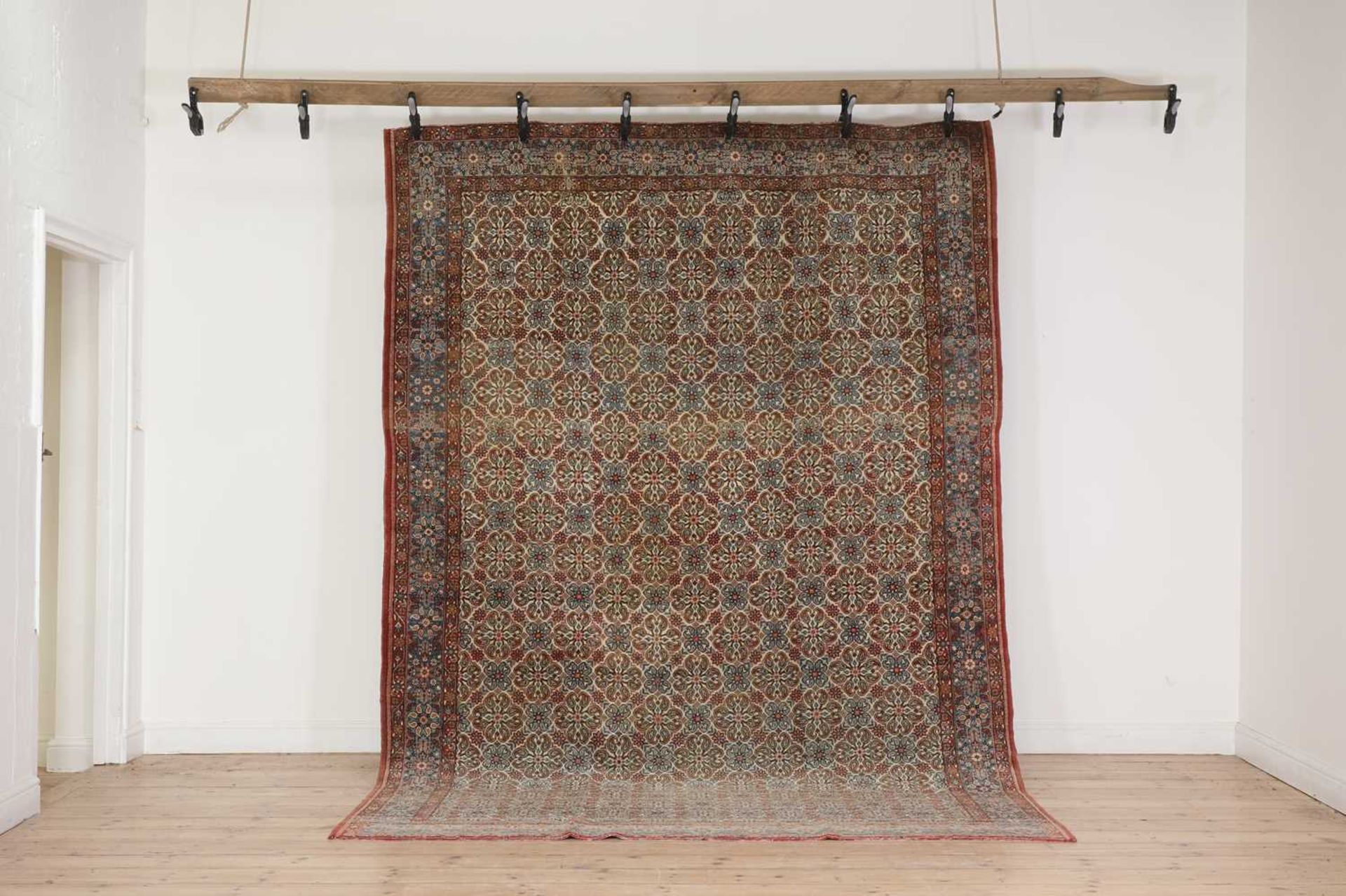 A Persian wool carpet,