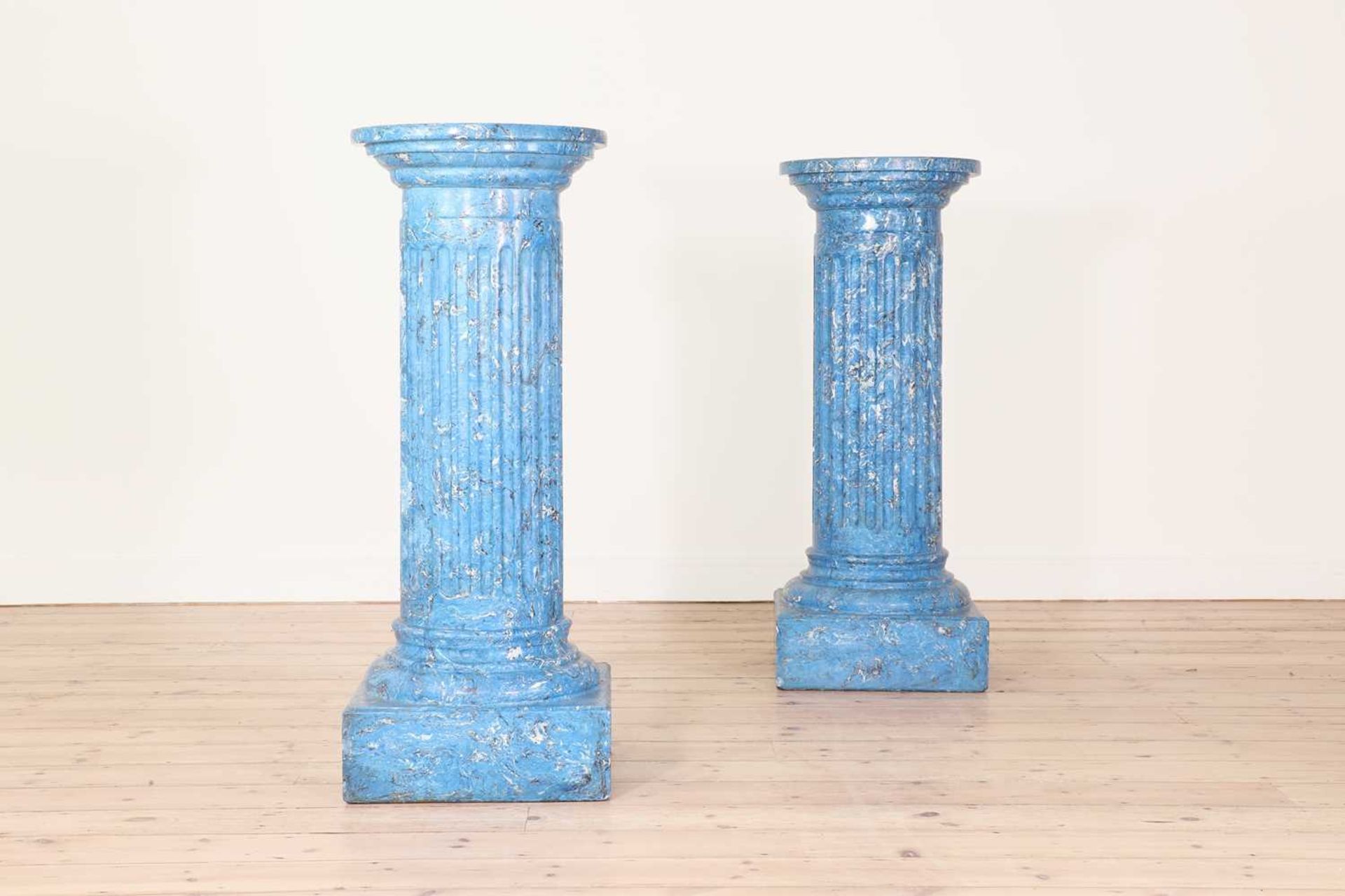 A pair of blue imitation marble columns,