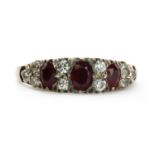 A gold ruby and diamond ring,