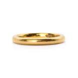 A 22ct gold court section wedding ring,