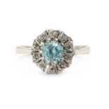 A white gold blue zircon and diamond ring,